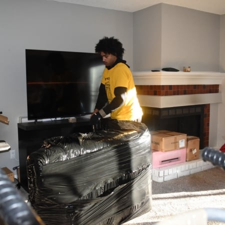 Pantheon Moving crew member carrying items during a Kansas City residential move