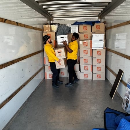 Pantheon Moving crew loading boxes into a truck for a Kansas City move