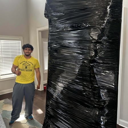 Pantheon Moving crew member carrying items during a Kansas City residential move